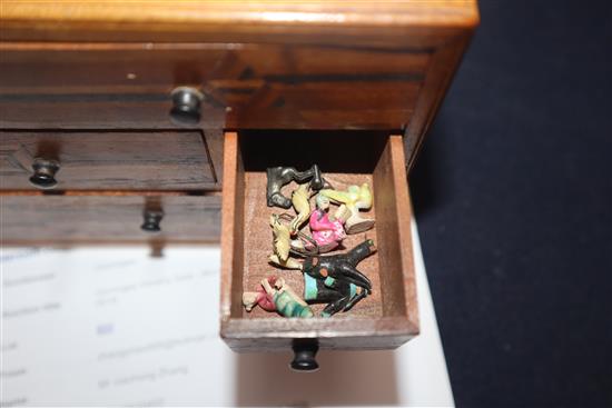 A collection of miniature glazed pottery Chinese figures, three metal Chinese figures and various collectables in a inlaid chest